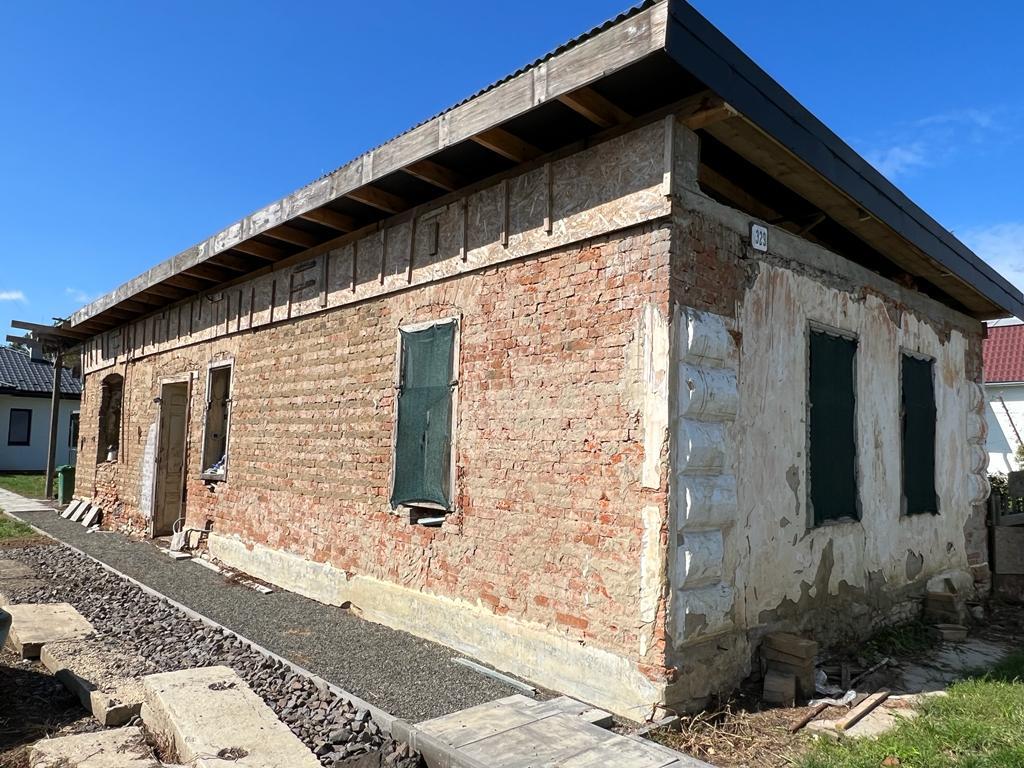 The Fried house in Budkovce under restoration, brick exposed